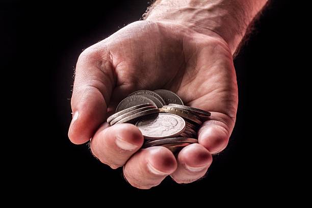 istock Money coins in hand 484639896