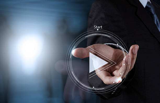 istock hand press play button sign to start or initiate projects 484642596