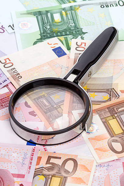 istock Magnifier and Euro banknotes 484649129