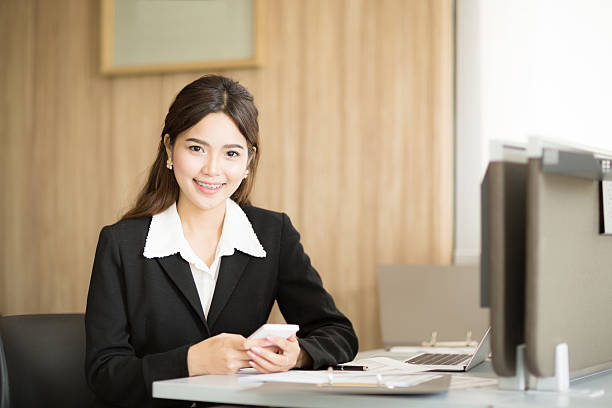 istock Young businesswoman sitting and smiling 484649534