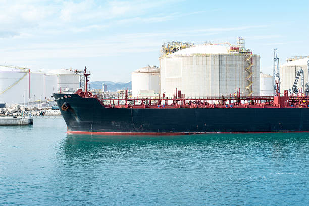 istock Tanker discharge oil into a refinery complex 484649927