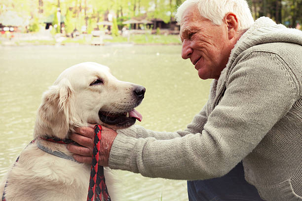istock Senior man with his dog. 484651271