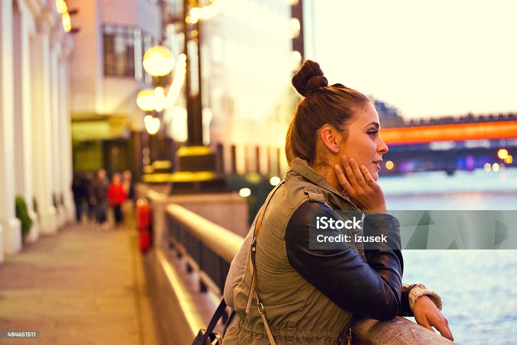 London sightseeing Side view of pensive young woman looking at Thames River. 20-24 Years Stock Photo