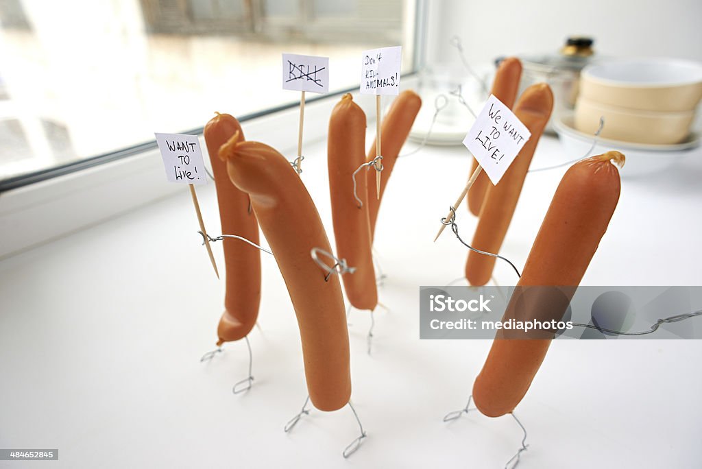 Protesting meat-eating Group of sausages protesting meat-eating Anger Stock Photo