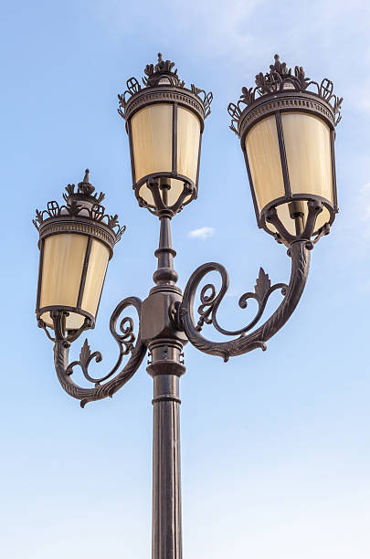 istock The classic elegant street lampposts with blue sky background. 484653306
