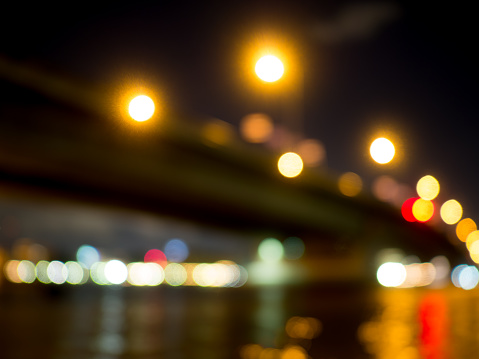 light at bridge and river on bokeh blur background