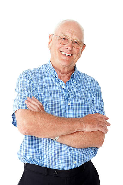istock Cheerful senior man standing with his arm against white 484654205