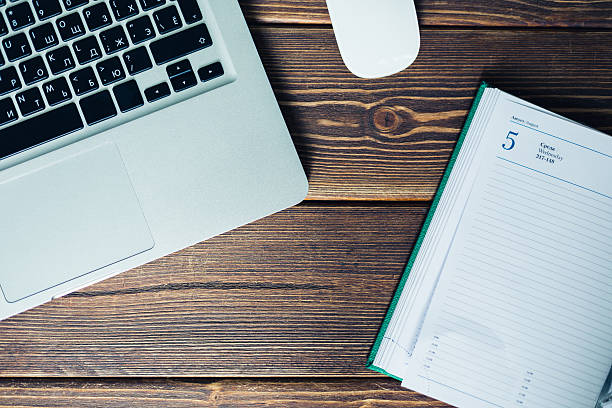 istock Laptop and diary on the desk 484654212