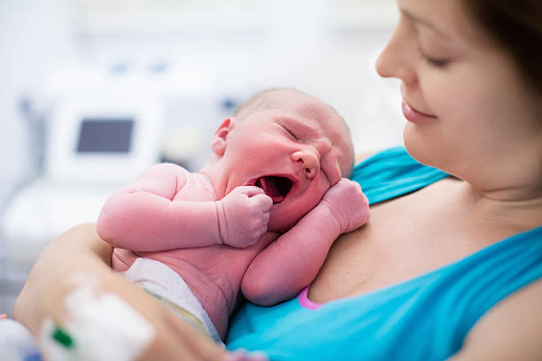 istock Young mother giving birth to a baby 484658040