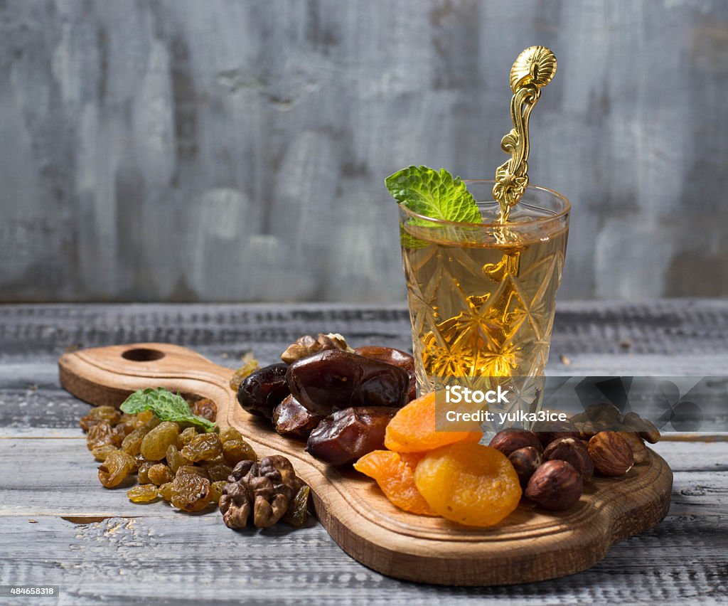 Traditional arabic tea and dry fruits Traditional arabic tea and dry fruits. Selective focus Dry Stock Photo