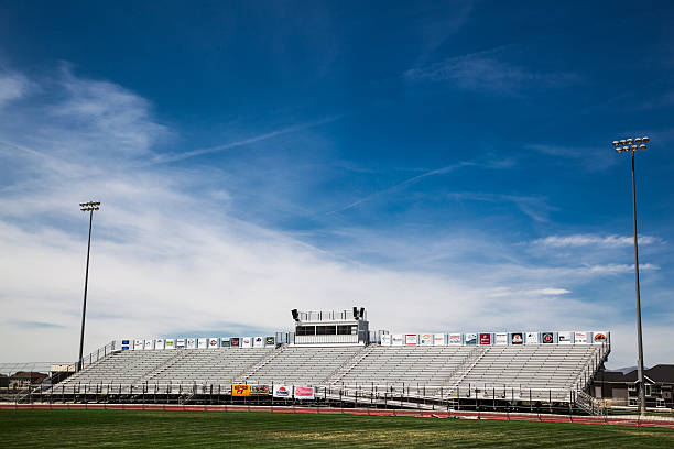 istock Sunny American stadium with  bleachers commentary box 484659114