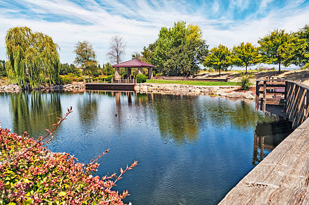 istock Pond with Gazebo and Walking Bridge 484660448