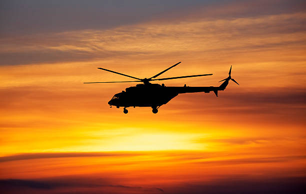 istock Picture of helicopter at sunset. 484664914