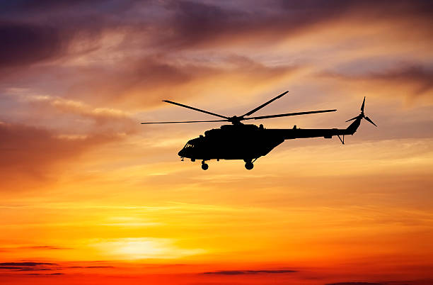 istock Picture of helicopter at sunset. 484664920