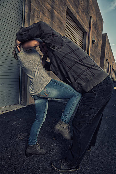 istock Girl uses her knee to defend herself. 484665518