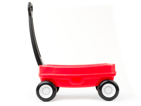 Red childrens wagon on white