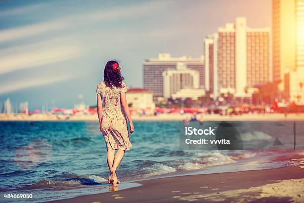 Young Woman Walking On The Beach In Tel Aviv Israel Stock Photo - Download Image Now