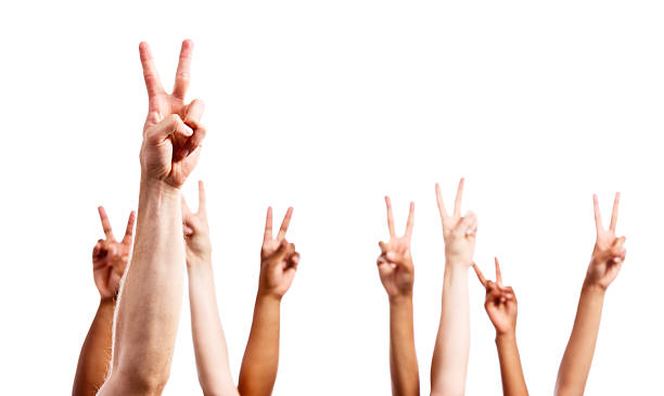 istock Eight mixed hands make V-sign for peace or victory 484669129