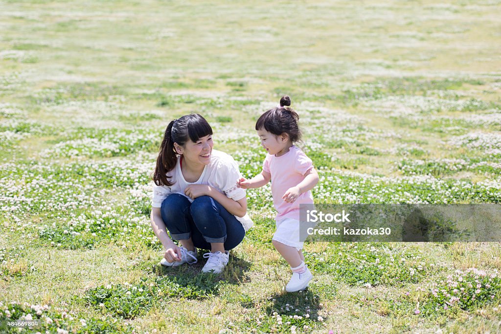 Mother and daughter Japanese mother and daughter playing in the park Child Stock Photo