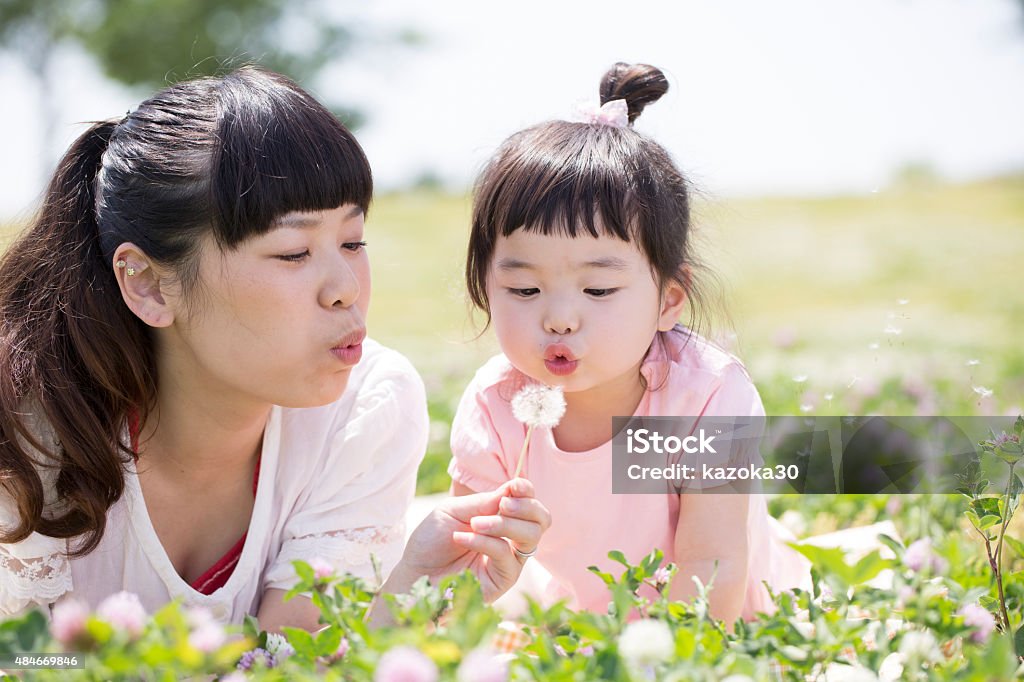 Mother and daughter Japanese mother and daughter playing in the park Baby - Human Age Stock Photo