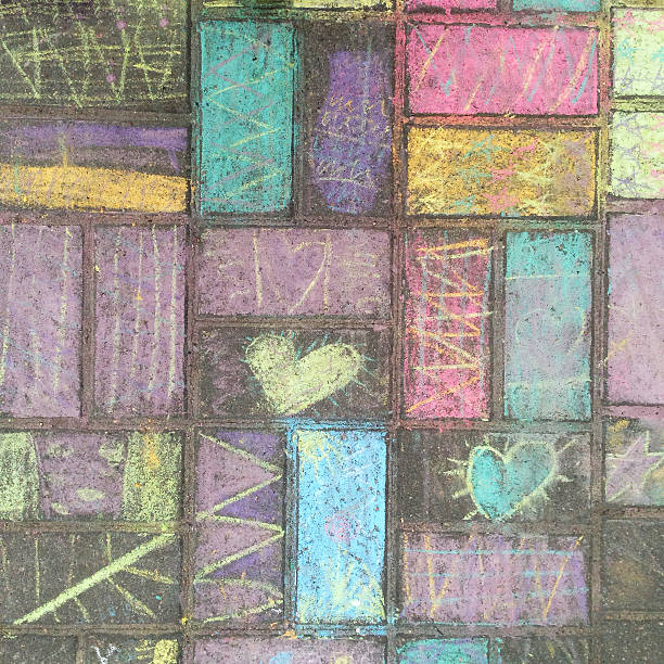 Child plays with colourful chalk