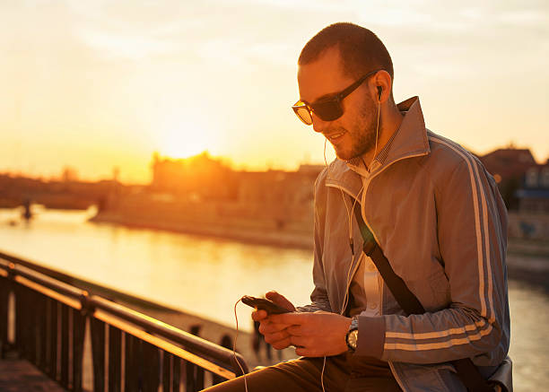 istock Young men using a smart phone in outdoors 484670257