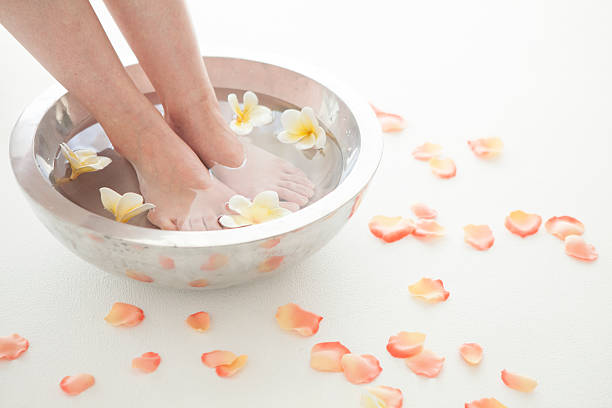 istock Feet dipped in aromatherapy bowl 484670468