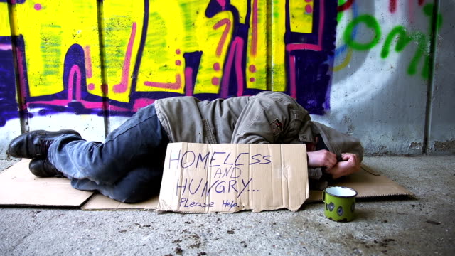 HD DOLLY: Homeless Person Sleeping In The Underpass