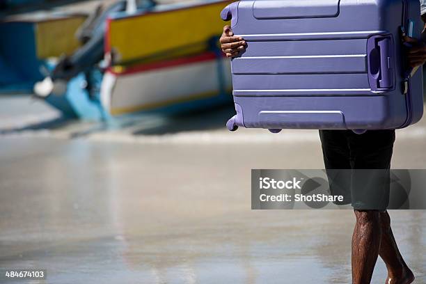 Man Carrying Luggage Stock Photo - Download Image Now - 30-39 Years, Adult, Adults Only