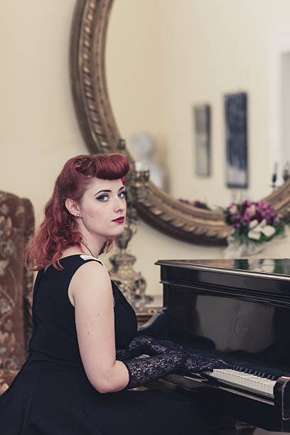istock Beautiful pin-up girl playing a piano 484674506