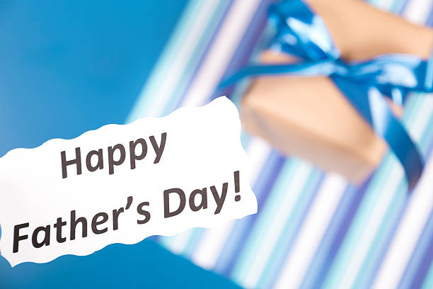 istock Holidays:  Father's Day gift for dad on blue background. 484674801