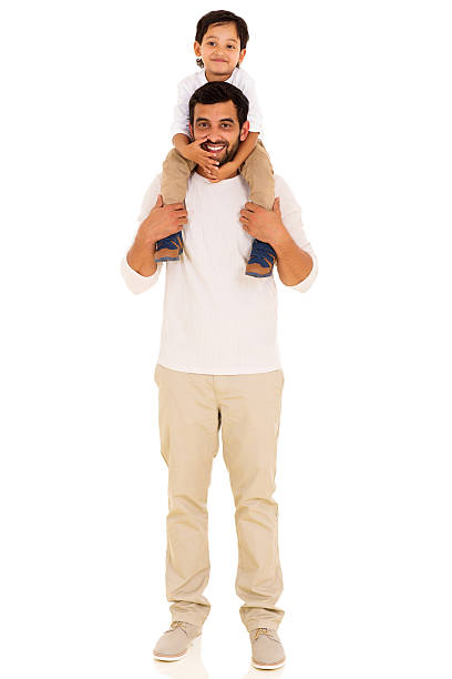 istock indian father carrying son on his shoulders 484675482