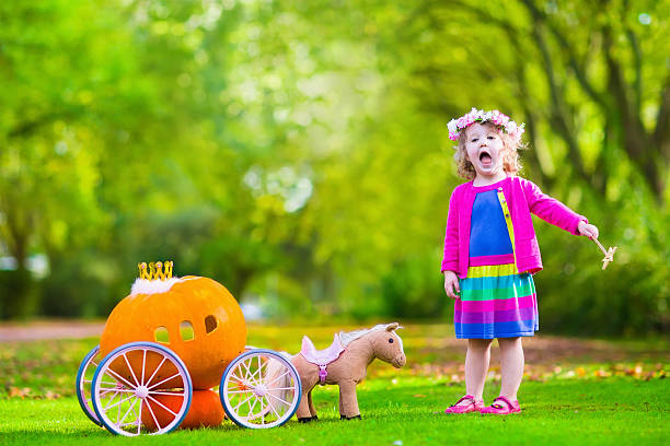 istock Little girl at pumpkin patch at Halloween 484675618