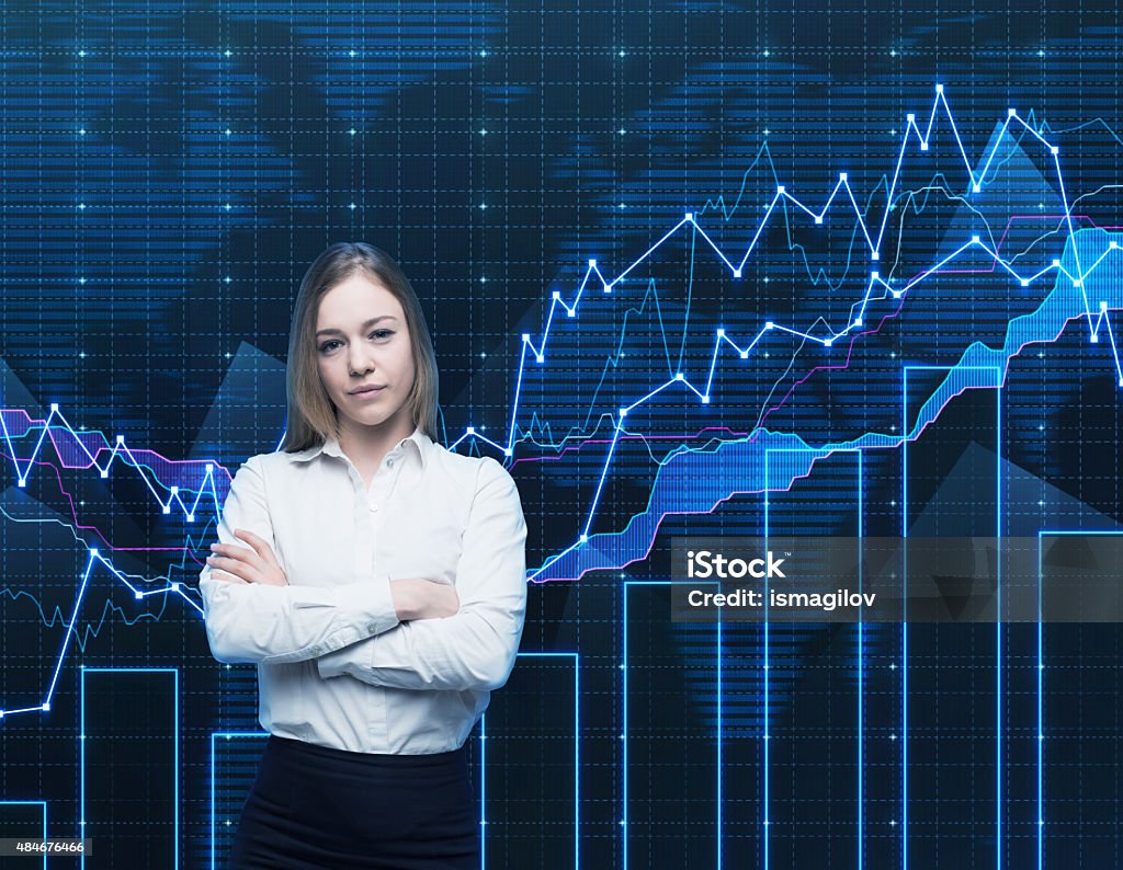 manager with crossed hands Closeup of beautiful portfolio manager with crossed hands in formal shirt. A concept of decision making process in finance. Forex chart is on the background. 2015 Stock Photo
