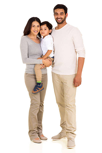 young indian family full length portrait full length portrait of happy young indian family isolated on white happy indian young family couple stock pictures, royalty-free photos & images
