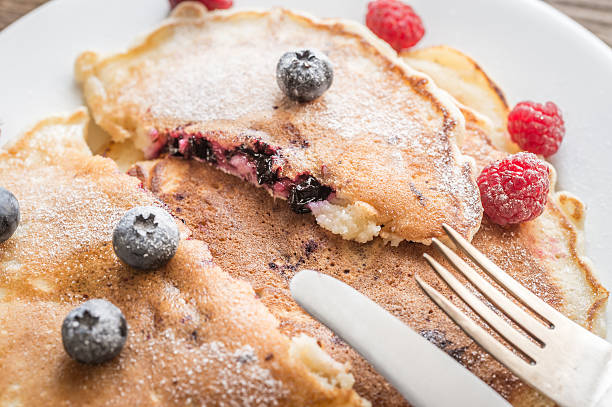 istock Pancakes with maple syrup and fresh berries 484676716