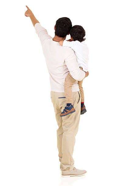 istock rear view of young indian father and son pointing 484679296
