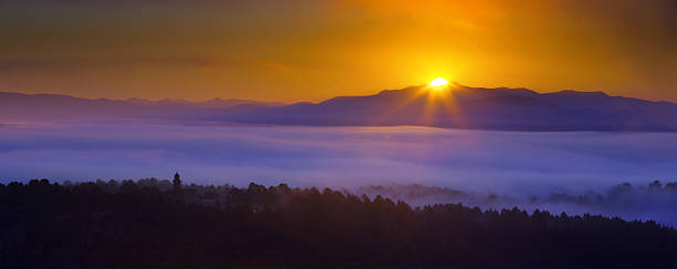 istock Misty dawn over wooded mountains 484679408