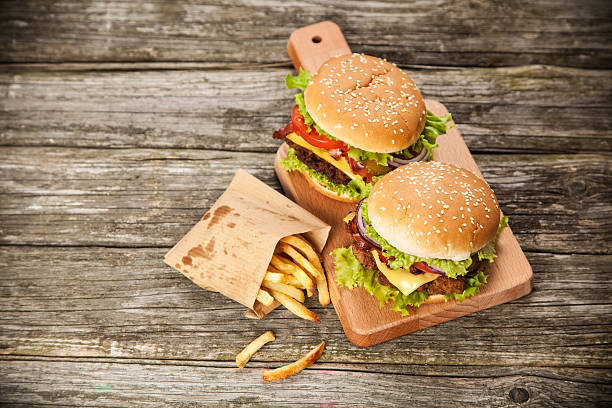 istock Delicious hamburger and fries 484679538