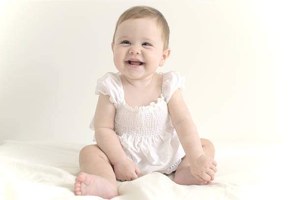 istock Baby girl sitting 484679626