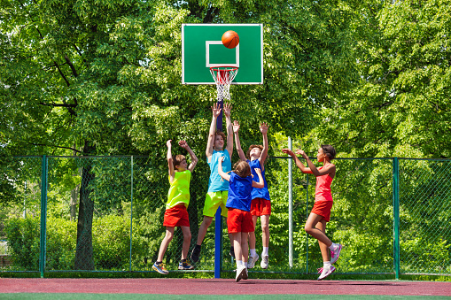 Young black basketball player working out on the outdoor court