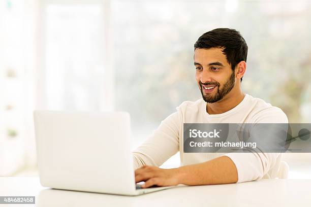 Young Indian Man Using Laptop Stock Photo - Download Image Now - 2015, Adult, Adults Only