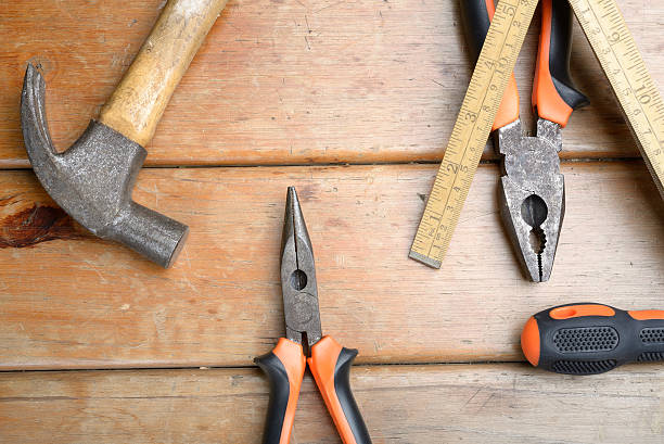 istock Hand Tools - Hammer, Phillips Screwdriver, Pliers and Wooden Met 484682500