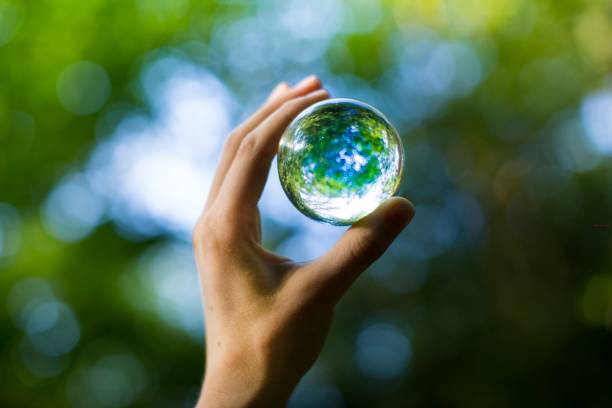 holding nature orb stock photo