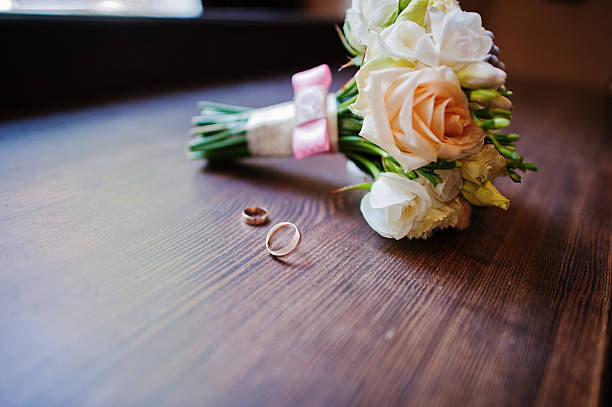istock wedding bouquet and ring on wooden background 484682876