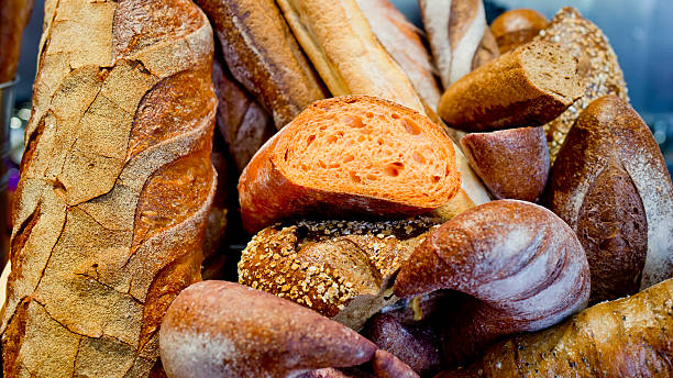 istock French bread baguettes in wooden box. 484684886