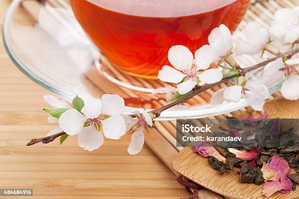 Japanese Green Tea And Sakura Branch Over Mat Stock Photo - Download Image Now - 2015, Bamboo - Material, Blossom