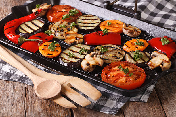 istock grilled vegetables: peppers, tomato, onion,  in pan grill 484685016