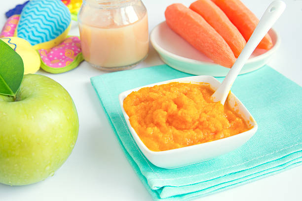 baby food - baby carrot stock-fotos und bilder