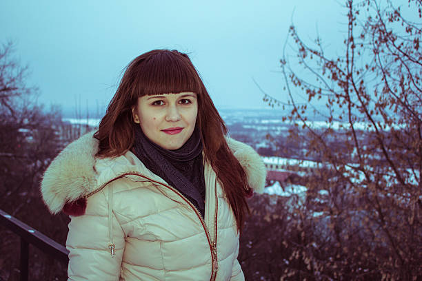 istock Smiling young girl in the winter. 484690106